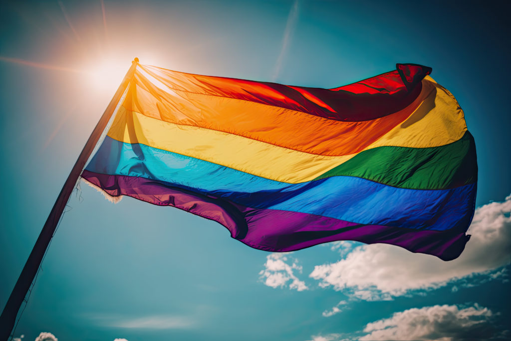 Inspirational Pride Flag against sky